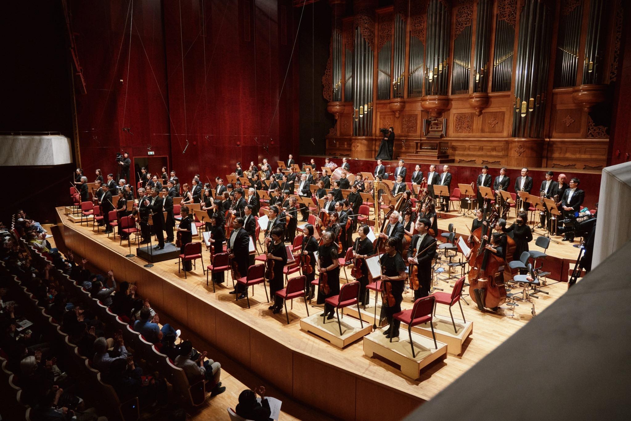 conducting the orchestra